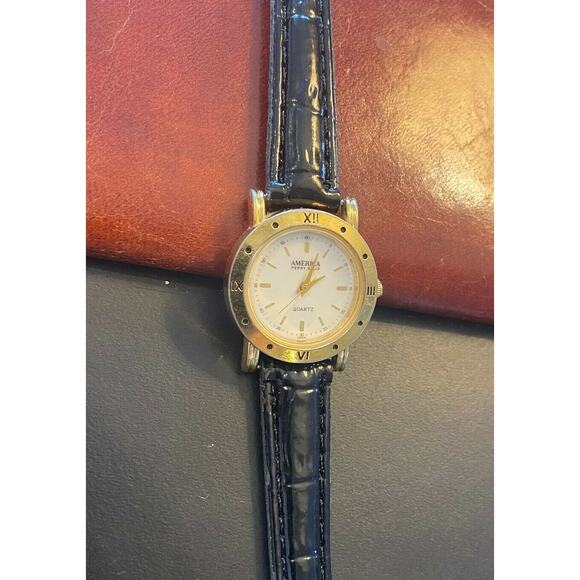 Women's 27mm Gold Tone America Perry Ellis Watch with Black Leather Band - Picture 2 of 2